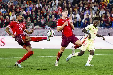 2024–25 UEFA Nations League, Switzerland vs Spain: Switzerland's Gregory Wuthrich, left,  Becir Omeragic, center, and Spain's midfielder Nico Williams, right, in action